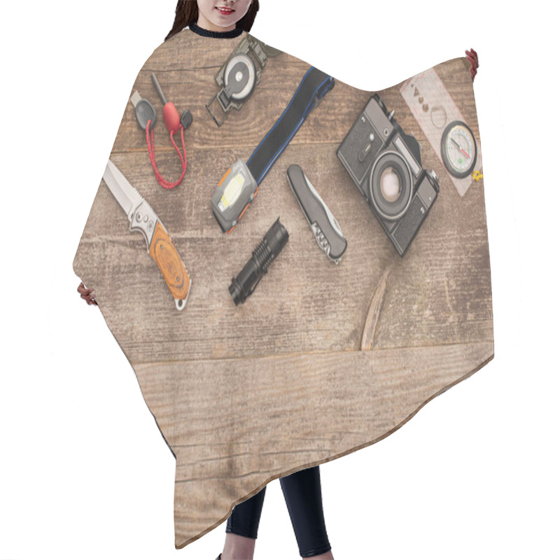 Personality  Top View Of Photo Camera And Hiking Equipment On Wooden Table Hair Cutting Cape