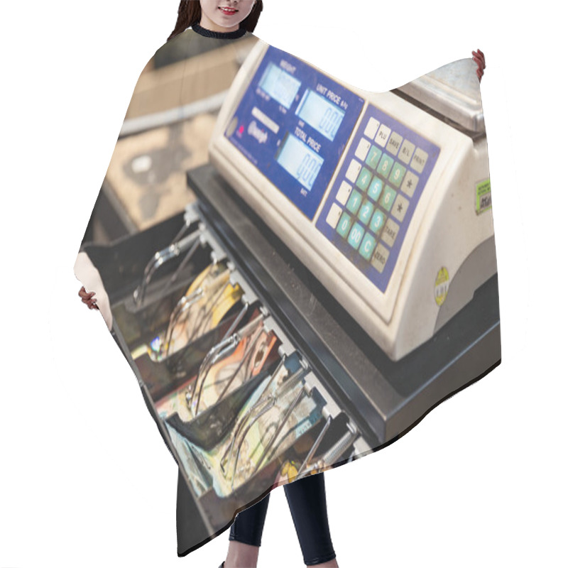 Personality  Gritty Cash Register At A Farmer's Market With Stacked Bank Notes Inside. Hair Cutting Cape