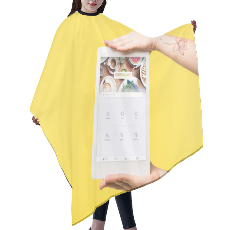 Personality  Cropped Shot Of Person Holding Digital Tablet With Foursquare Website On Screen Isolated On Yellow   Hair Cutting Cape