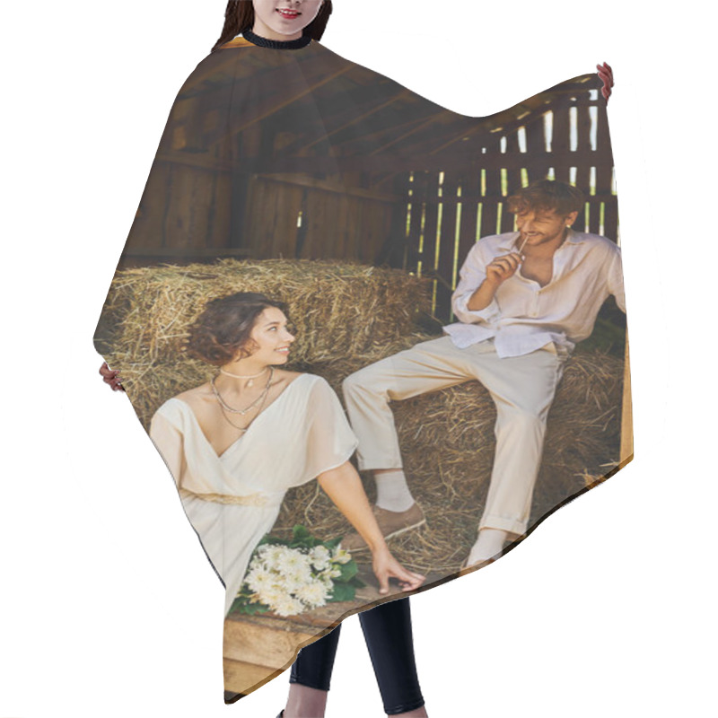 Personality  Happy Asian Bride In White Dress Holding Bouquet And Sitting On Hay Near Groom In Barn, Rural Hair Cutting Cape