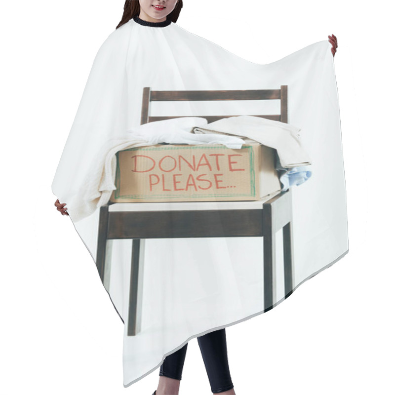 Personality  Cardboard Box With Donated Clothes On Wooden Chair On White Hair Cutting Cape