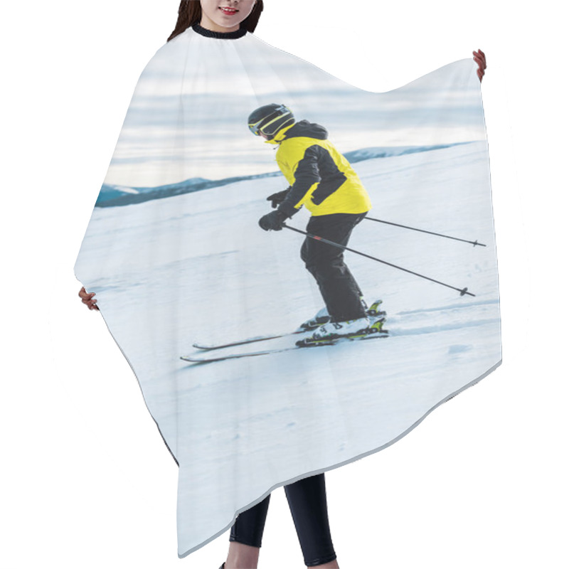 Personality  Skier In Helmet Holding Sticks And Skiing On Slope Outside  Hair Cutting Cape