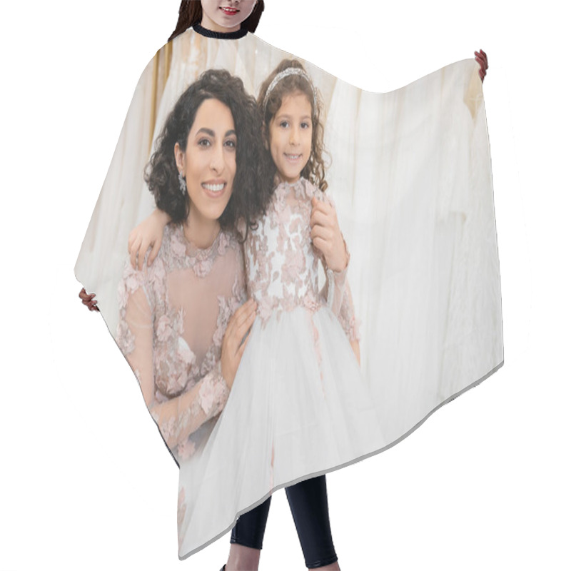 Personality  Special Moment, Happy Middle Eastern Woman In Floral Wedding Gown Sitting And Embracing Her Little Daughter In Bridal Salon Around White Tulle Fabrics, Bridal Shopping, Togetherness, Bride-to-be  Hair Cutting Cape