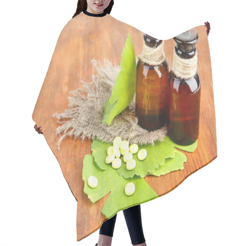 Personality  Ginkgo Biloba Leaves And Medicine Bottles On Wooden Background Hair Cutting Cape