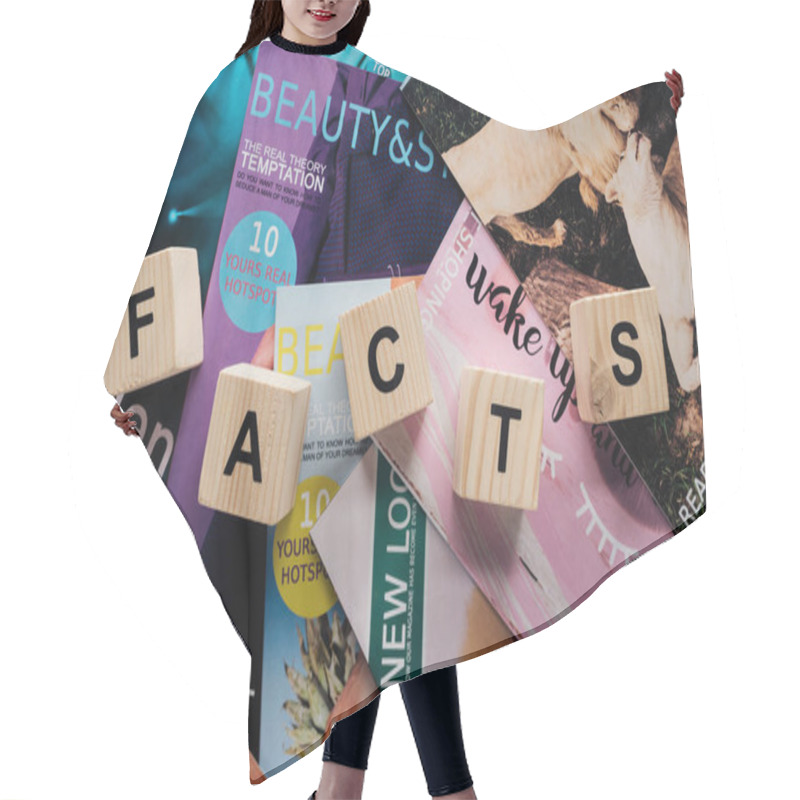 Personality  Top View Of Pile Of Different Tabloid Magazines And Wooden Cubes With Word Facts On Surface Hair Cutting Cape