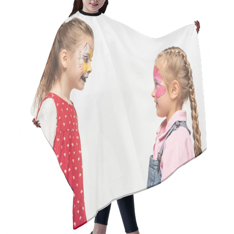 Personality  Side View Of Smiling Friends With Cat Muzzle And Butterfly Paintings On Faces Looking At Each Other Isolated On White Hair Cutting Cape