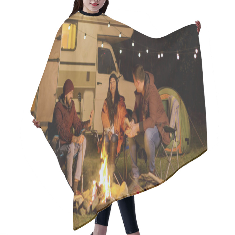 Personality  Group Of Close Friends Laughing Together Around Camp Fire Hair Cutting Cape