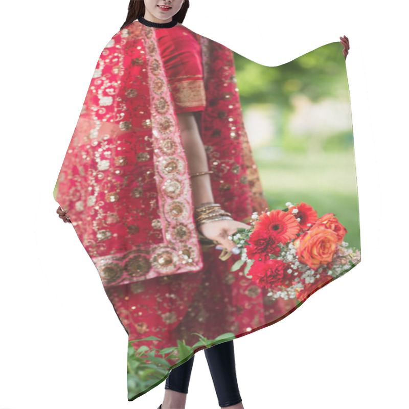 Personality  Cropped View Of Indian Bride In Red Sari And Traditional Headscarf With Ornament Holding Flowers Hair Cutting Cape