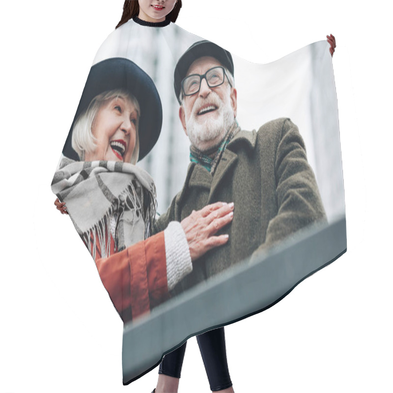 Personality  Pleased Senior Woman Embracing Her Happy Husband Hair Cutting Cape