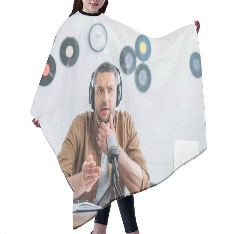 Personality  Thoughtful Radio Host In Headphones Recording Podcast In Broadcasting Studio Hair Cutting Cape