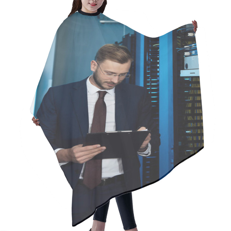 Personality  Handsome Businessman In Glasses Holding Clipboard In Data Center  Hair Cutting Cape