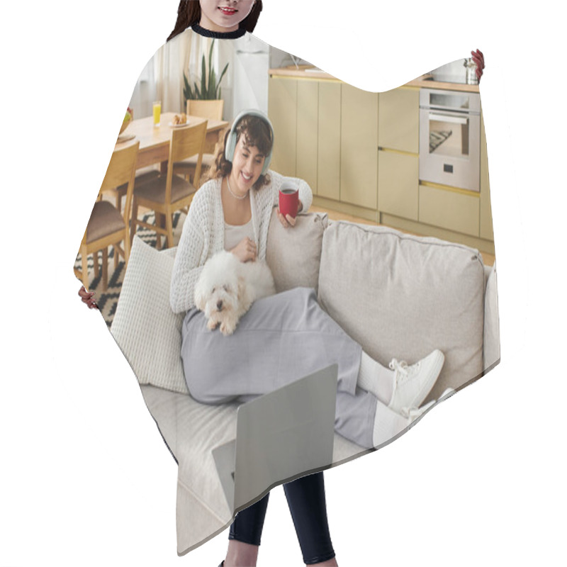 Personality  Relaxing At Home, A Young Woman Drinks From A Red Mug While Cuddling Her Dog On The Couch. Hair Cutting Cape