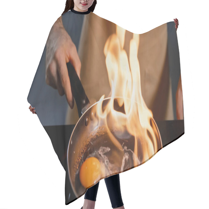 Personality  Cropped View Of Man Frying Chicken Egg With Flambe Method  Hair Cutting Cape