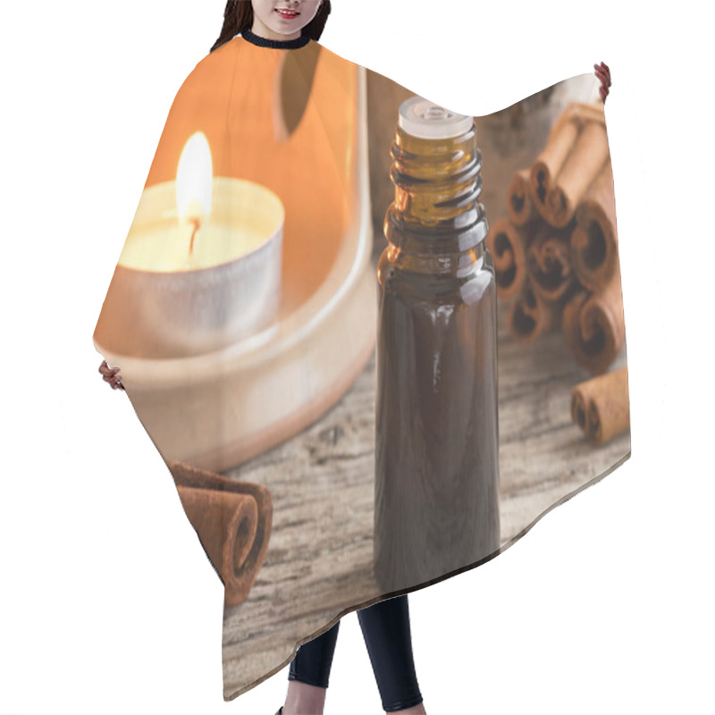 Personality  A Bottle Of Cinnamon Essential Oil With Cinnamon Sticks Hair Cutting Cape