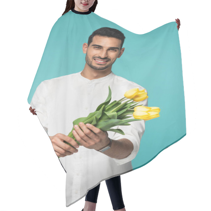 Personality  Yellow Tulips In Hands Of Smiling Arabian Man On Blurred Background Isolated On Blue  Hair Cutting Cape