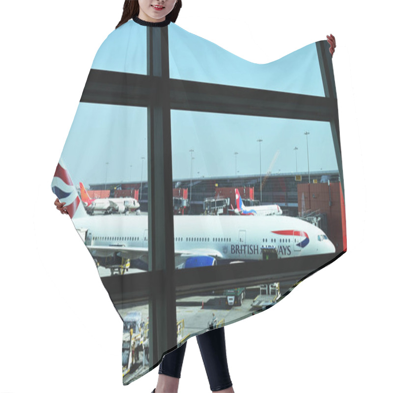 Personality  London, United Kingdom - September 07, 2015: British Airways Airplane Picture Is Captured Through Airport Window At Hitro Airport In London. Hair Cutting Cape