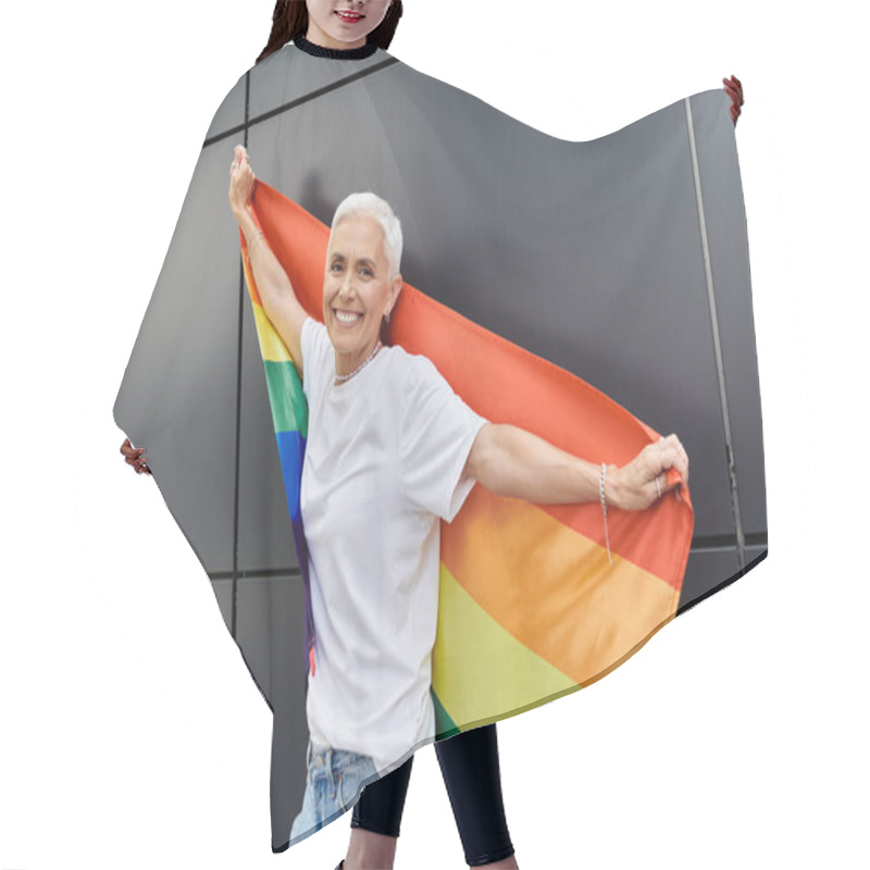 Personality  A Confident Woman Joyfully Embraces A Rainbow Flag In A Modern City Backdrop. Hair Cutting Cape