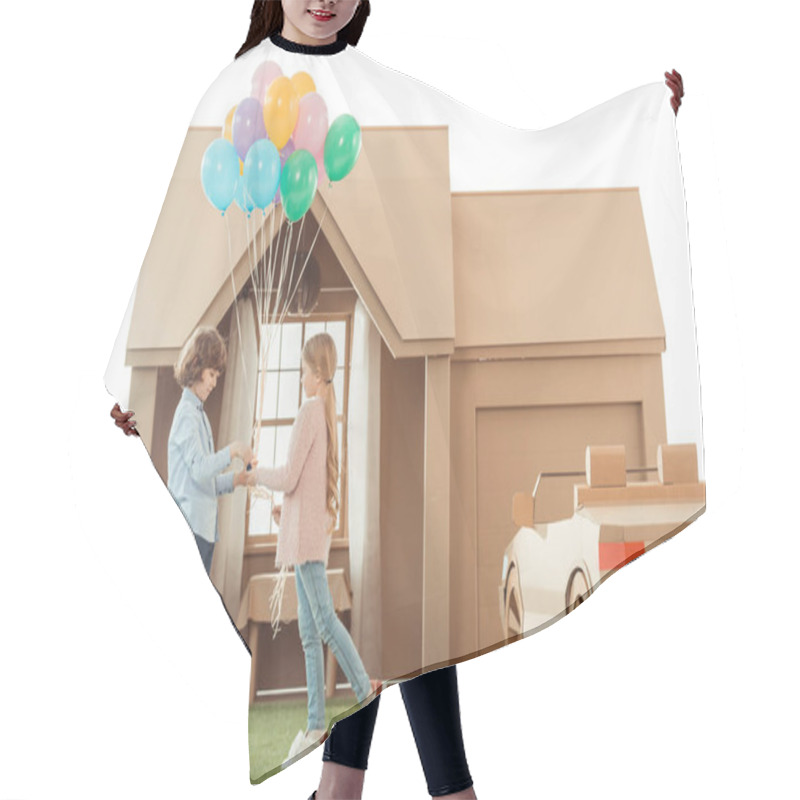 Personality  Kid Presenting Balloons To Girlfriend In Front Of Cardboard House Isolated On White Hair Cutting Cape