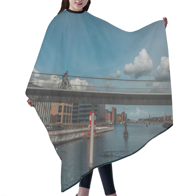 Personality  COPENHAGEN, DENMARK - APRIL 30, 2020: People Cycling On Bridge Above River With Urban Street And Sky With Clouds At Background  Hair Cutting Cape