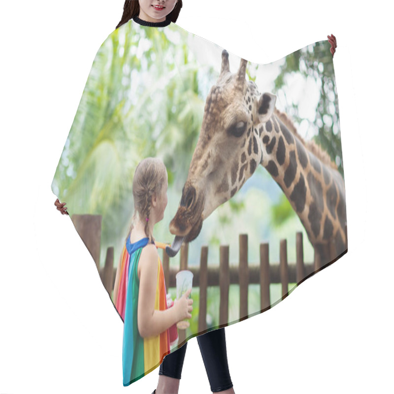 Personality  Family Feeding Giraffe In Zoo. Children Feed Giraffes In Tropical Safari Park During Summer Vacation In Singapore. Kids Watch Animals. Little Girl Giving Fruit To Wild Animal. Hair Cutting Cape