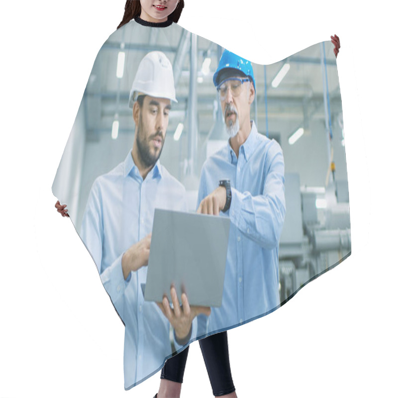 Personality  Head Of The Project Holds Laptop And  Discusses Product Details With Chief Engineer While They Walk Through Modern Factory. Hair Cutting Cape