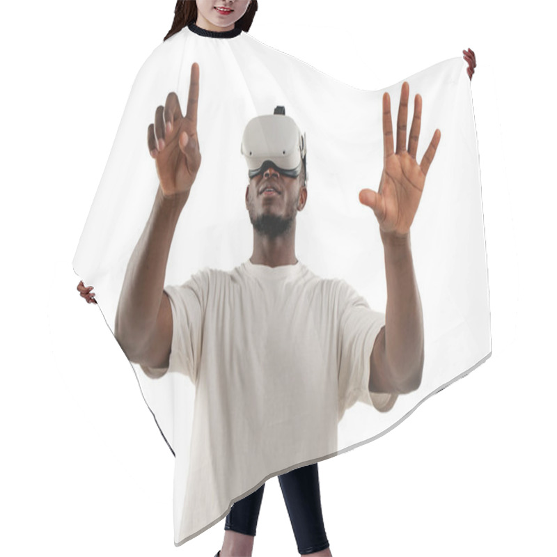 Personality  African American Man Plays Video Games In Virtual Reality Glasses And Touches With His Hand On White Isolated Background, The Guy Looks In Vr Glasses To The Side Chooses And Points With His Finger Hair Cutting Cape