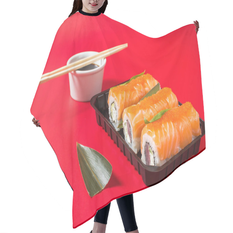 Personality  Philadelphia Roll Sushi With Salmon, Avocado, Cream Cheese On Red Background. Hair Cutting Cape