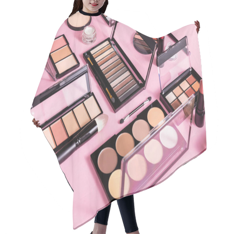 Personality  Blush And Eye Shadow Palettes Near Cosmetic Brushes And Lipsticks On Pink Hair Cutting Cape