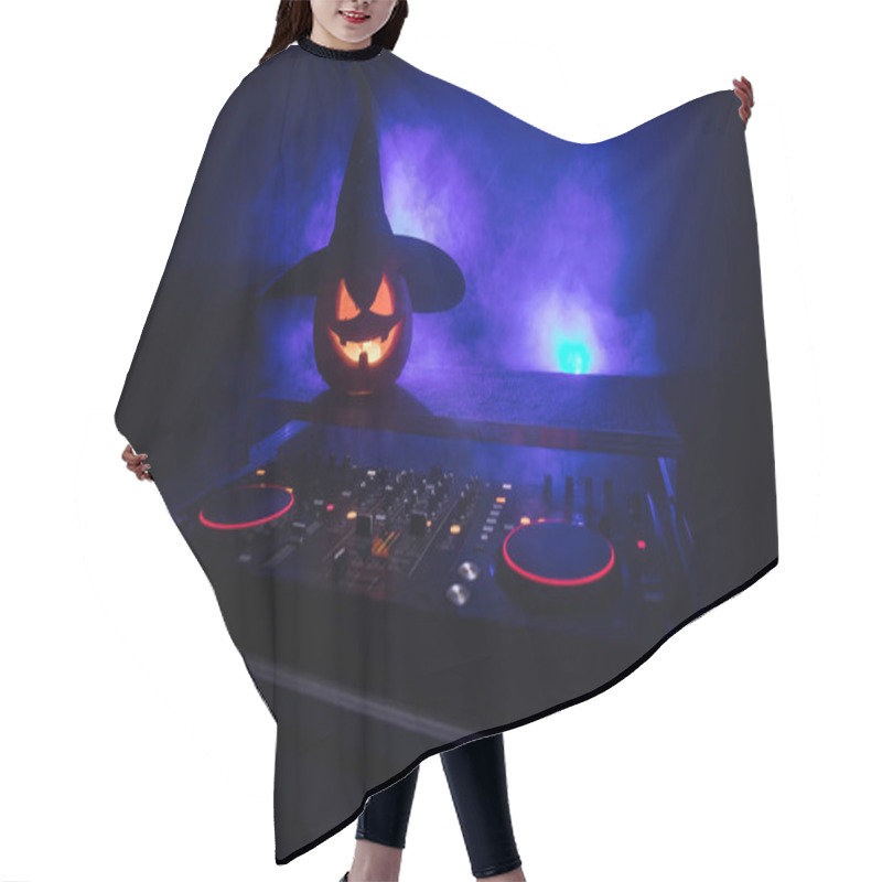 Personality  Halloween Pumpkin On A Dj Table With Headphones On Dark Background With Copy Space. Happy Halloween Festival Decorations And Music Concept. Empty Space. Selective Focus Hair Cutting Cape