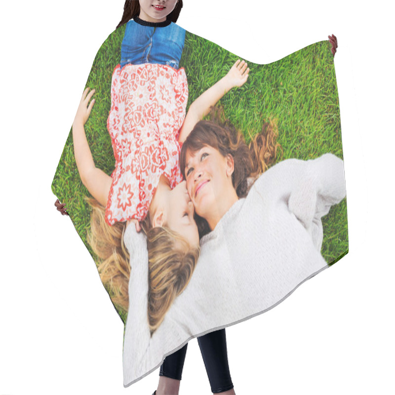 Personality  Happy Mother And Daughter Relaxing Outside On Green Grass. Spend Hair Cutting Cape