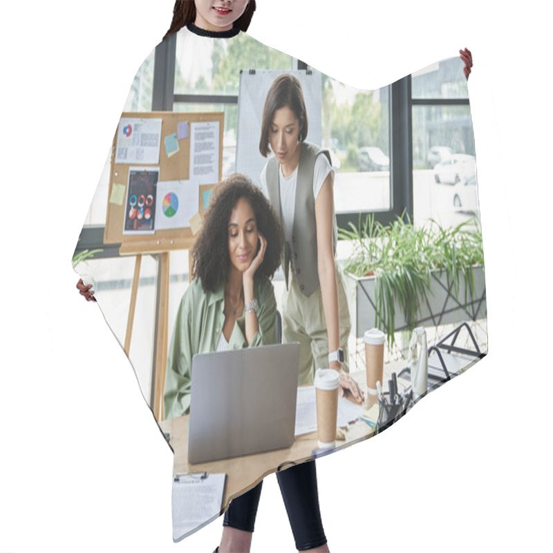 Personality  Two Women, A Lesbian Couple, Work Together On A Laptop At A Desk In A Modern Office. Hair Cutting Cape