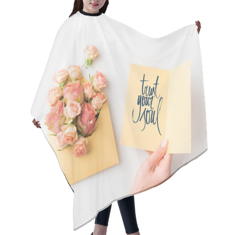 Personality  Hand Holding Paper With TRUST YOUR SOUL Sign Beside Pink Flowers In Envelope Isolated On White Hair Cutting Cape