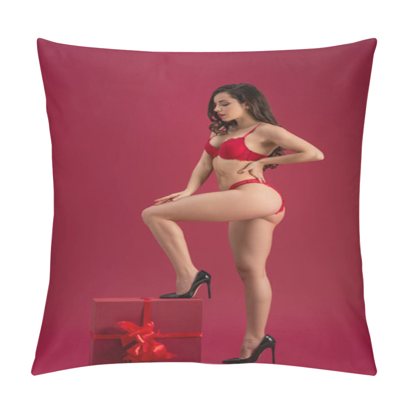 Personality  Seductive Girl In Lingerie And High Heeled Shoes Stepping On Large Gift Box Isolated On Red Pillow Covers