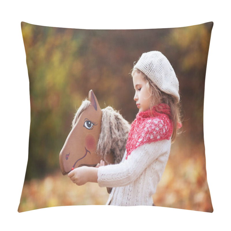 Personality  Cute Little Girl Feeds A Wooden Toy Horse In The Autumn Garden. Pillow Covers