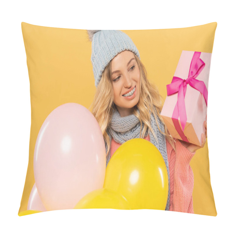 Personality  Smiling Woman In Hat And Scarf Holding Balloons And Looking At Gift Box Isolated On Yellow Pillow Covers