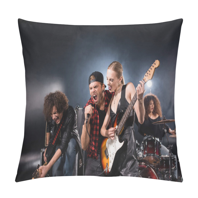 Personality  KYIV, UKRAINE - AUGUST 25, 2020: Vocalist Shouting In Microphone Standing Near Guitarists With Woman Playing Drums And Backlight On Black Pillow Covers