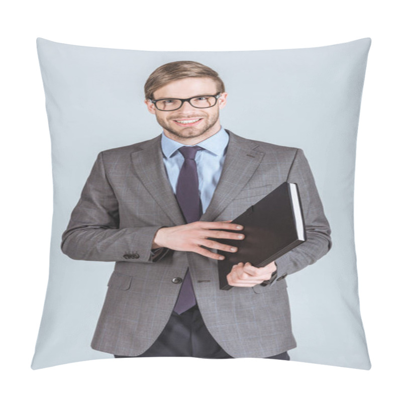 Personality  Young Smiling Businessman Opening Notebook Isolated On Grey Pillow Covers