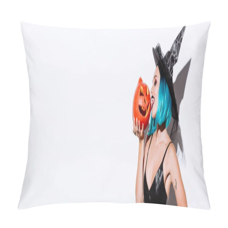 Personality  Panoramic Shot Of Sexy Girl In Black Witch Halloween Costume With Blue Hair Licking Spooky Carved Pumpkin On White Background Pillow Covers