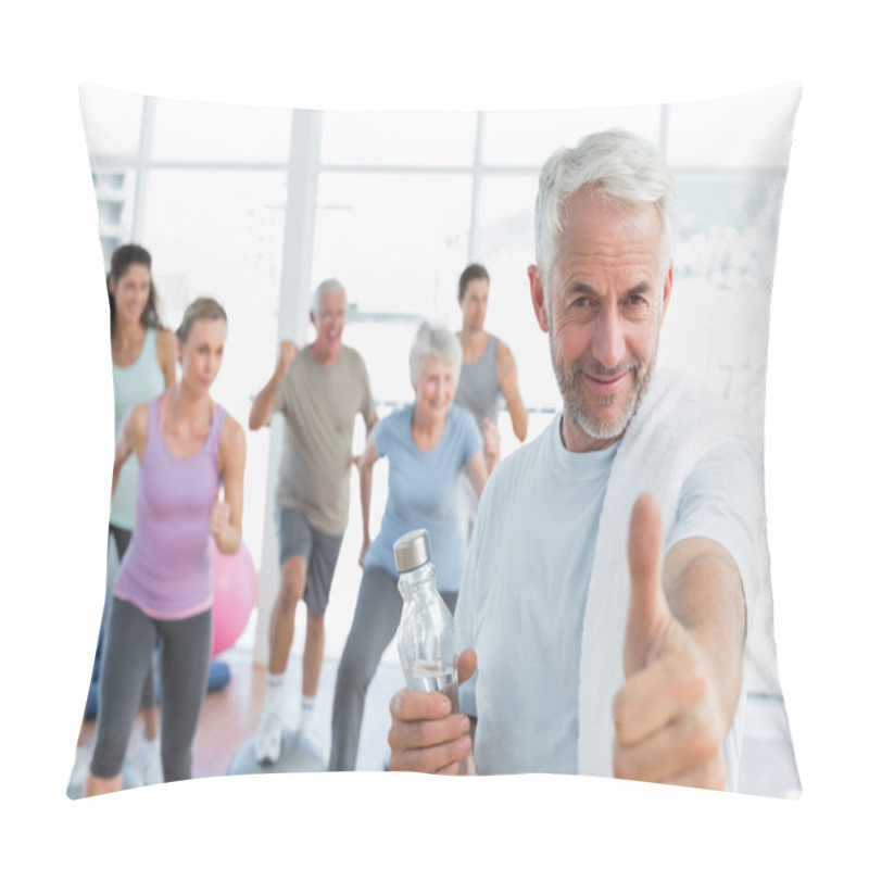 Personality  Senior Man Gesturing Thumbs Up With People Exercising In Fitness Studio Pillow Covers