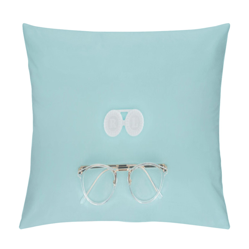 Personality  Top View Of Eyeglasses And Contact Lenses Container On Blue Background Pillow Covers