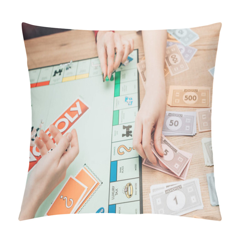 Personality  KYIV, UKRAINE - NOVEMBER 15, 2019: Cropped View Of Women Playing Monopoly Game At Table Pillow Covers