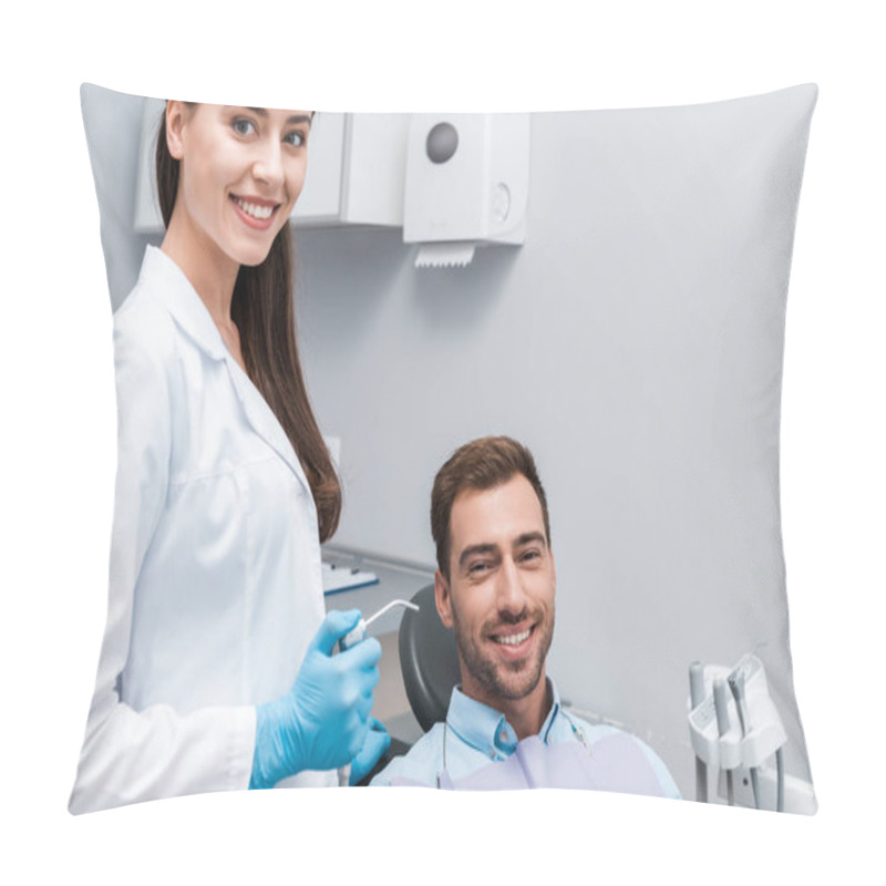 Personality  Attractive And Happy Dentist Holding Dental Equipment Near Happy Man  Pillow Covers