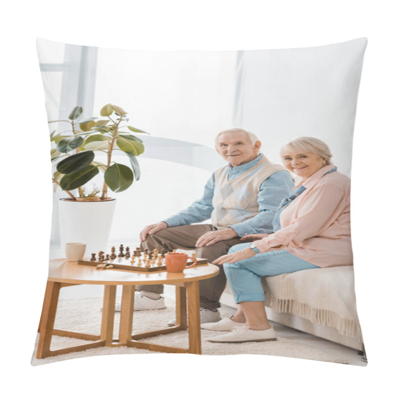 Personality  Senior Couple Sitting On Sofa And Playing Chess Pillow Covers