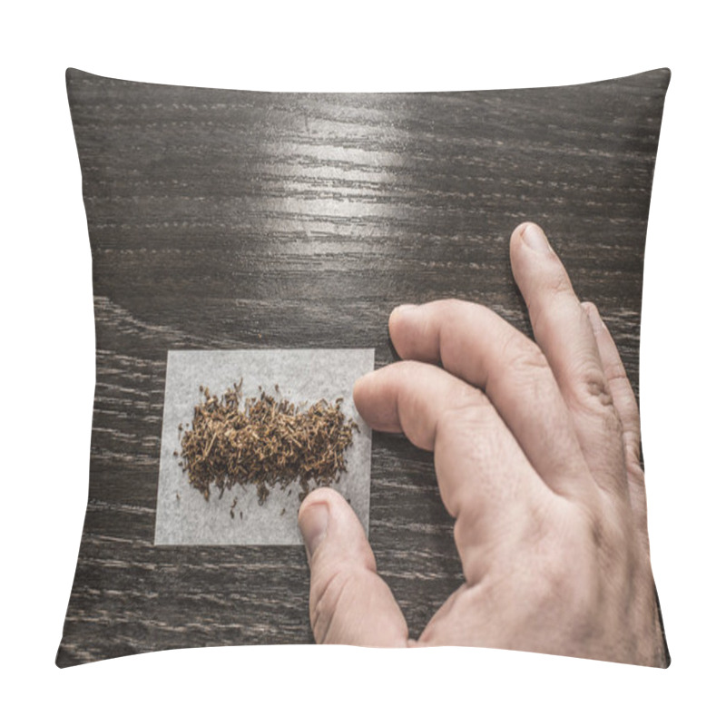 Personality  Hand Rolling A Cigarette Paper With Tobaccoon Black Wooden Table Background. Pillow Covers