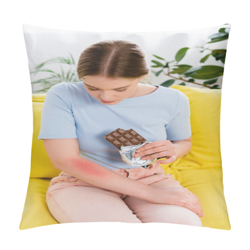 Personality  Young Woman Holding Chocolate Bar And Looking At Allergy Reaction On Arm  Pillow Covers