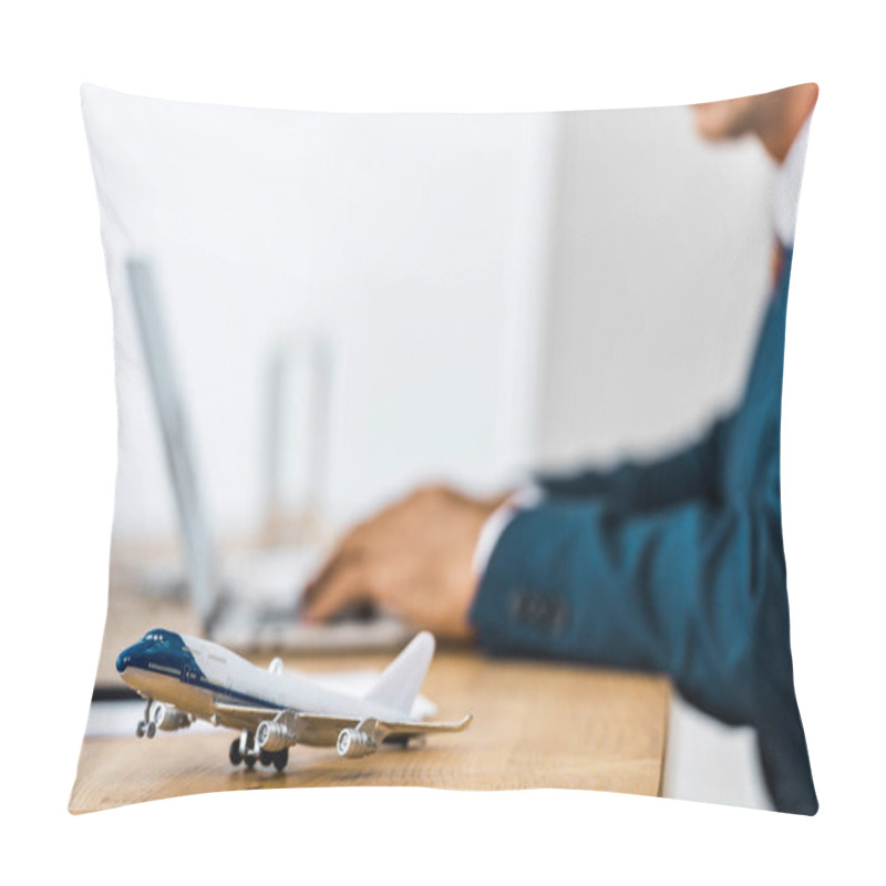 Personality  Toy Airplane At Wooden Table With Office Worker Using Laptop On Blurred Background  Pillow Covers