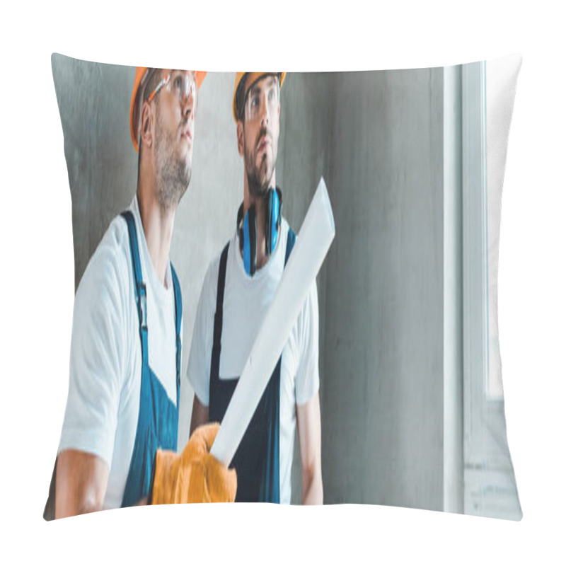 Personality  Panoramic Shot Of Handsome Repairman Holding Paper Roll Near Coworker  Pillow Covers