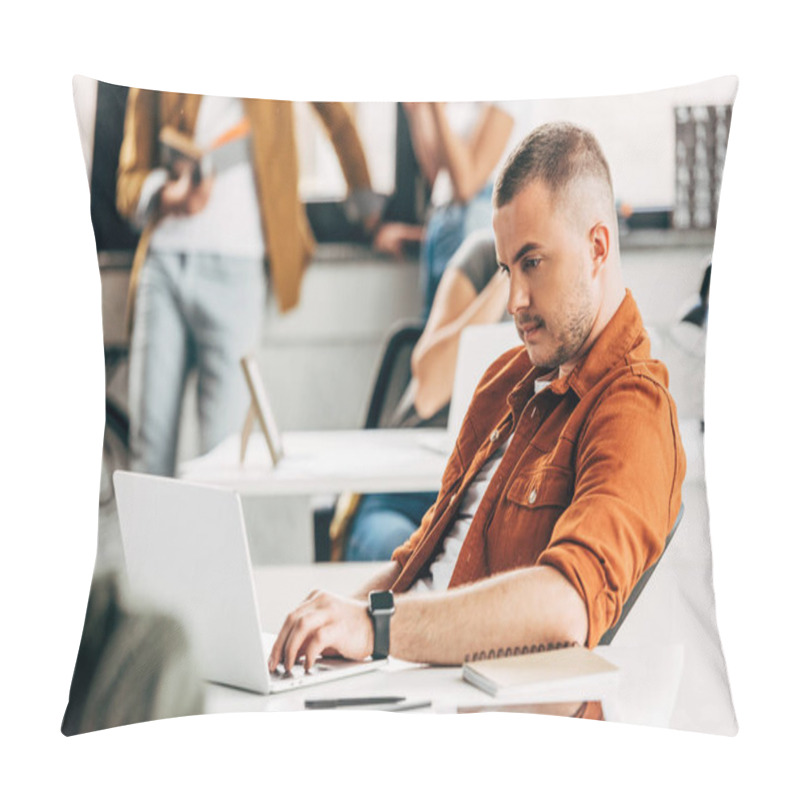 Personality  Young Man Working With Laptop At Open Space Office With Colleagues On Background Pillow Covers