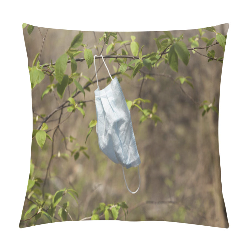 Personality  Used Medical Mask Hangs On A Branch. The End Of The Pandemic. Concept - Breathe Freely. Pillow Covers