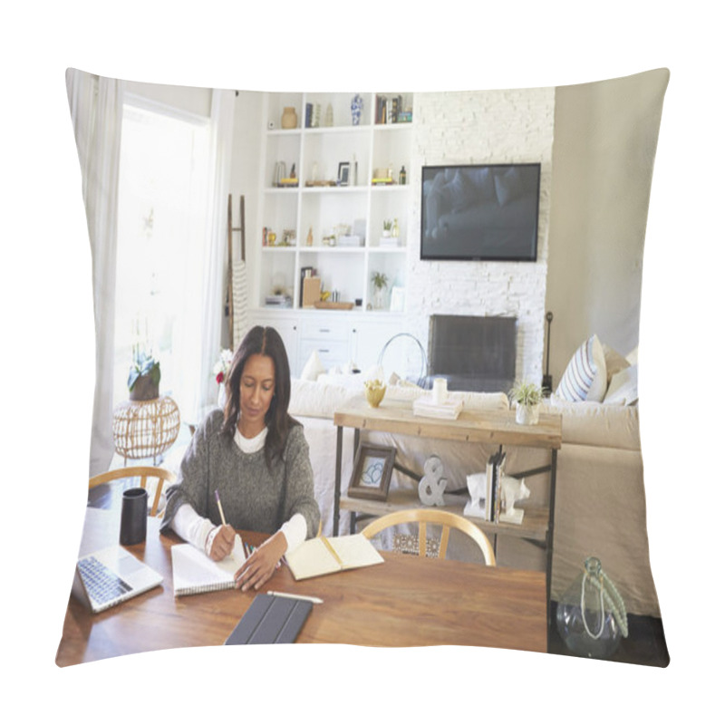 Personality  Happy Middle Aged Mixed Race Woman Sitting At Table In Her Dining Room Making Notes, Elevated View Pillow Covers